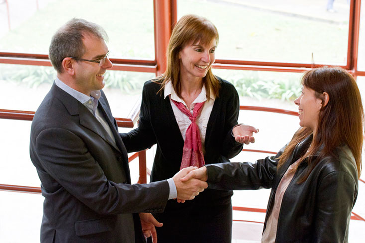 Figure 5 shows one businesswoman introducing his business partner to another businesswoman