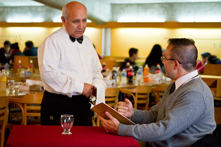 Figure 32 shows a waiter recommending dishes